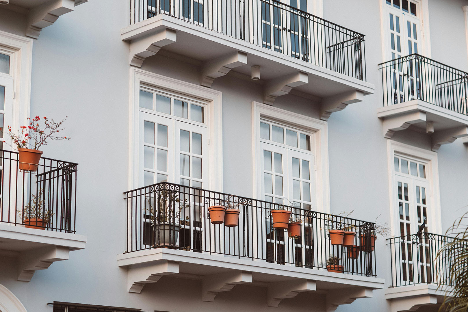 A balcony with french doors in an apartment building.
