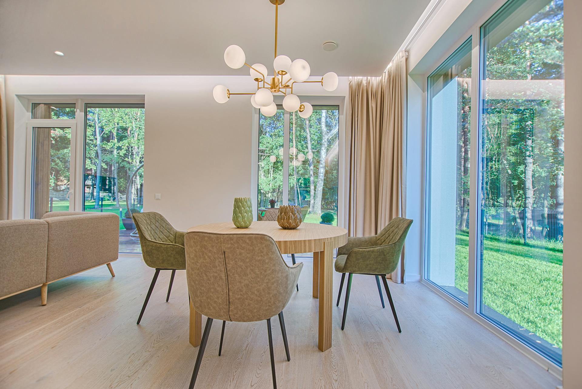 A modern dining table with a hanging pendant light fitting.