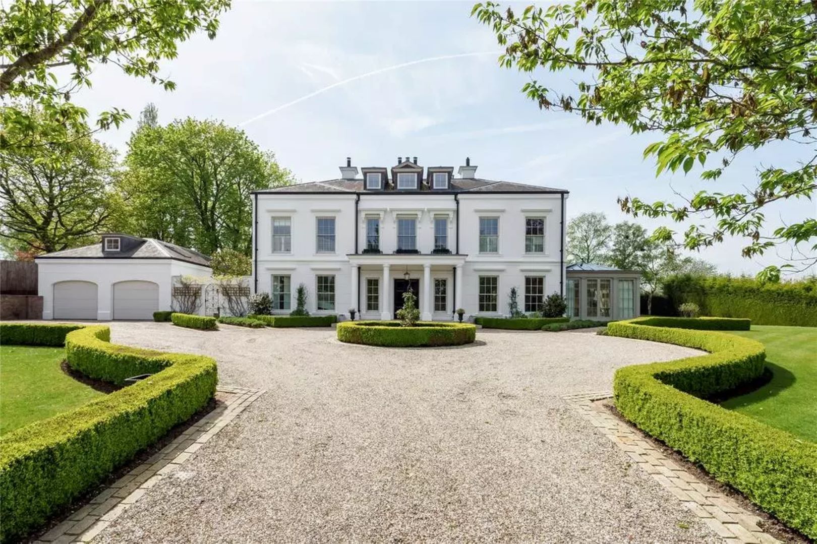Large white house with carriage driveway